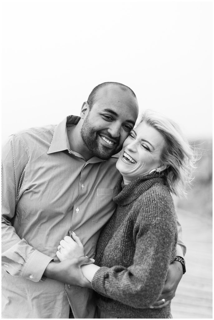 black and white portrait of the couple smiling at the camera by film photographer AGS Photo Art