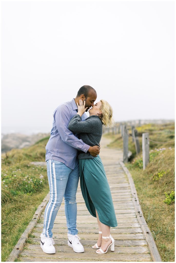 kissing couple portrait at Pebble Beach