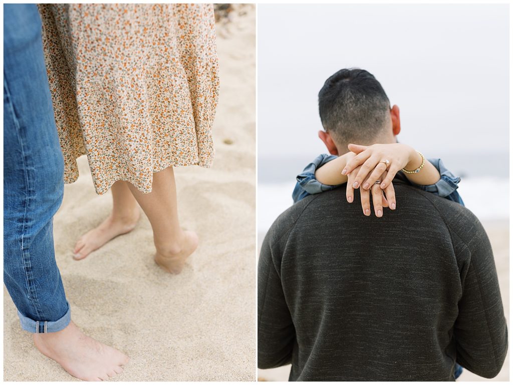 couple's feet in the sand; photo from behind the couple with the woman's hands behind her fiancé's neck