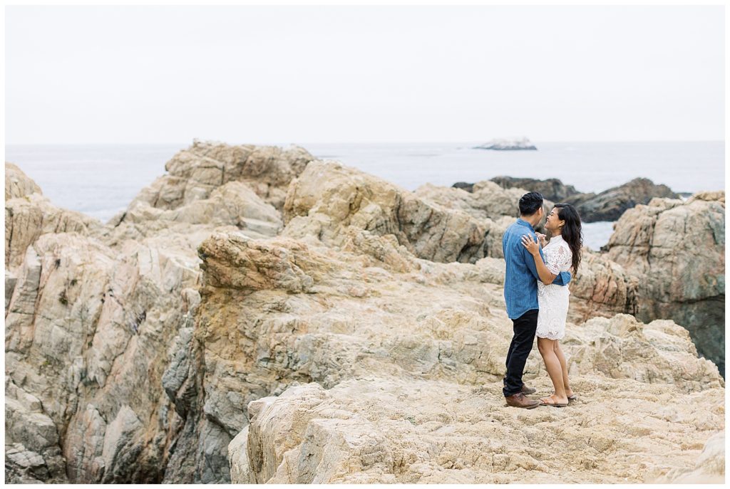 photo of the couple on the cliffside overlooking the ocean by film photographer AGS Photo Art