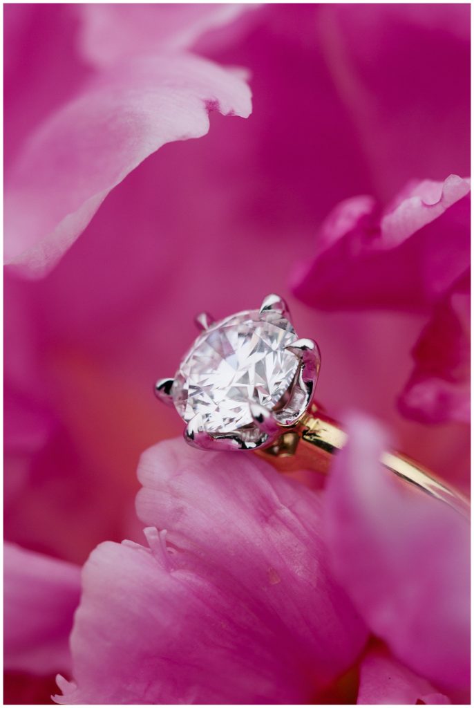 Glen Oaks Big Sur engagement ring in between pink peony petals from Flor De Monterey