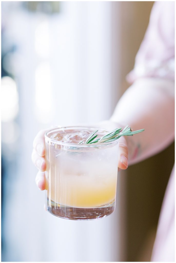 cocktail with sprig of rosemary for carmel food guide post