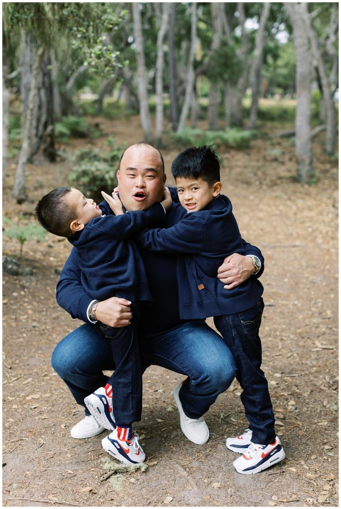 Dad hugging his boys