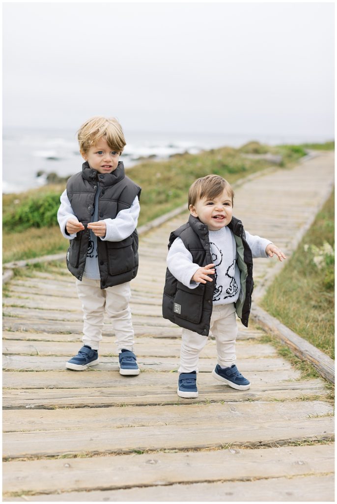 two baby boys at Pebble Beach on the boardwalk