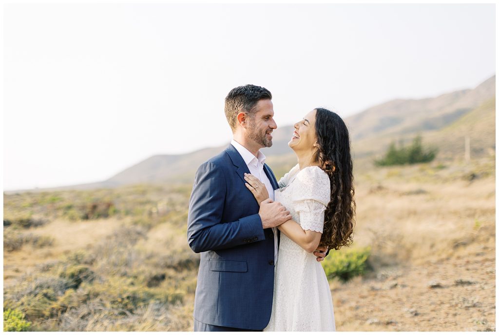 landscape photo of new bride laughing while her soon-to-be husband holds her close by film photographer AGS Photo Art