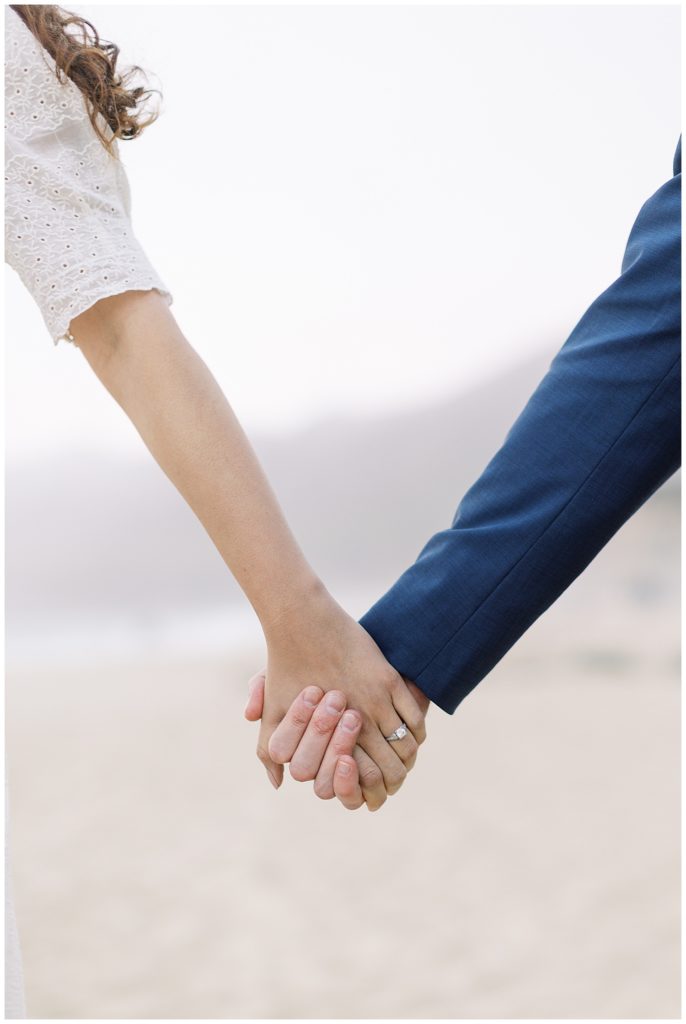 couple's hands clasped in each other's