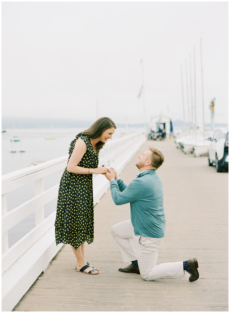 Surprise Proposal In Pebble Beach popping the question on the pier
