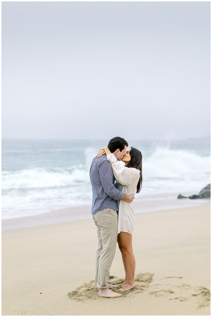couple sharing a kiss on the beach