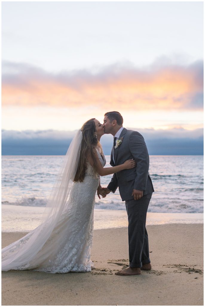 portrait of the bride and groom sharing a kiss at their sunset wedding in Big Sur