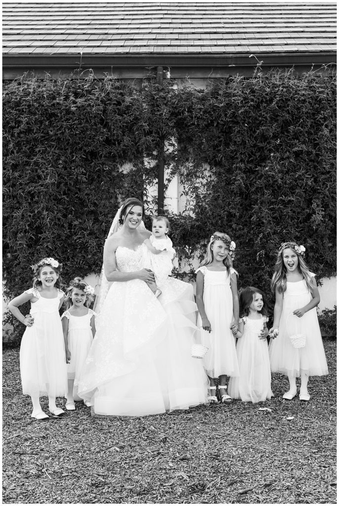 black and white bridal portrait with the flower girls