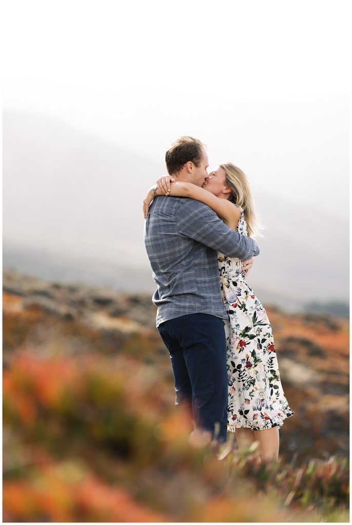 portrait of couple in Big Sur sharing a kiss after their Post Ranch Inn surprise proposal
