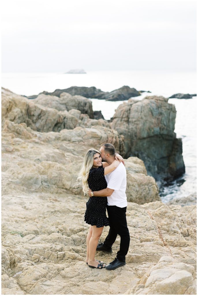 portrait of the couple on the cliffs overlooking the water during their Big Sur anniversary session