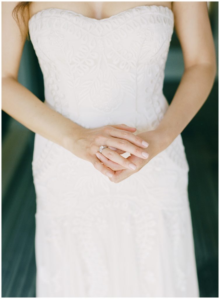Bernardus Lodge wedding portrait of the bride from the shoulders down with a focus on her ring by Langs Antiques