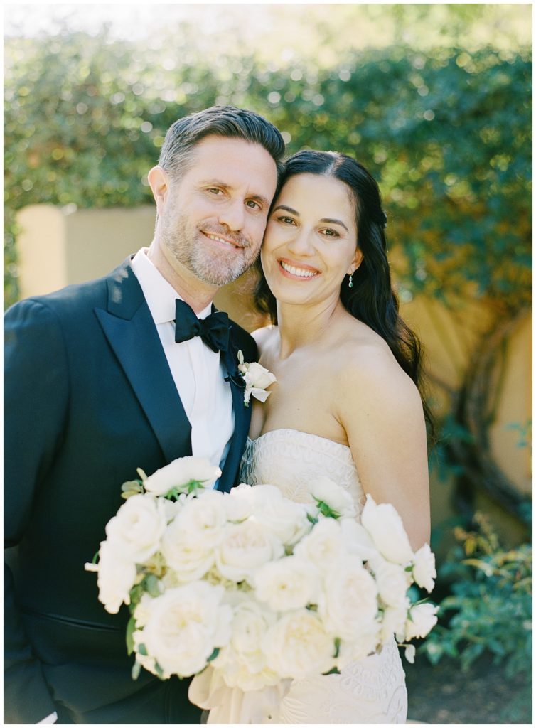 Bernardus Lodge & Spa wedding portrait of the bride and groom in the rose garden with the bride's white rose Gavita Flora bouquet