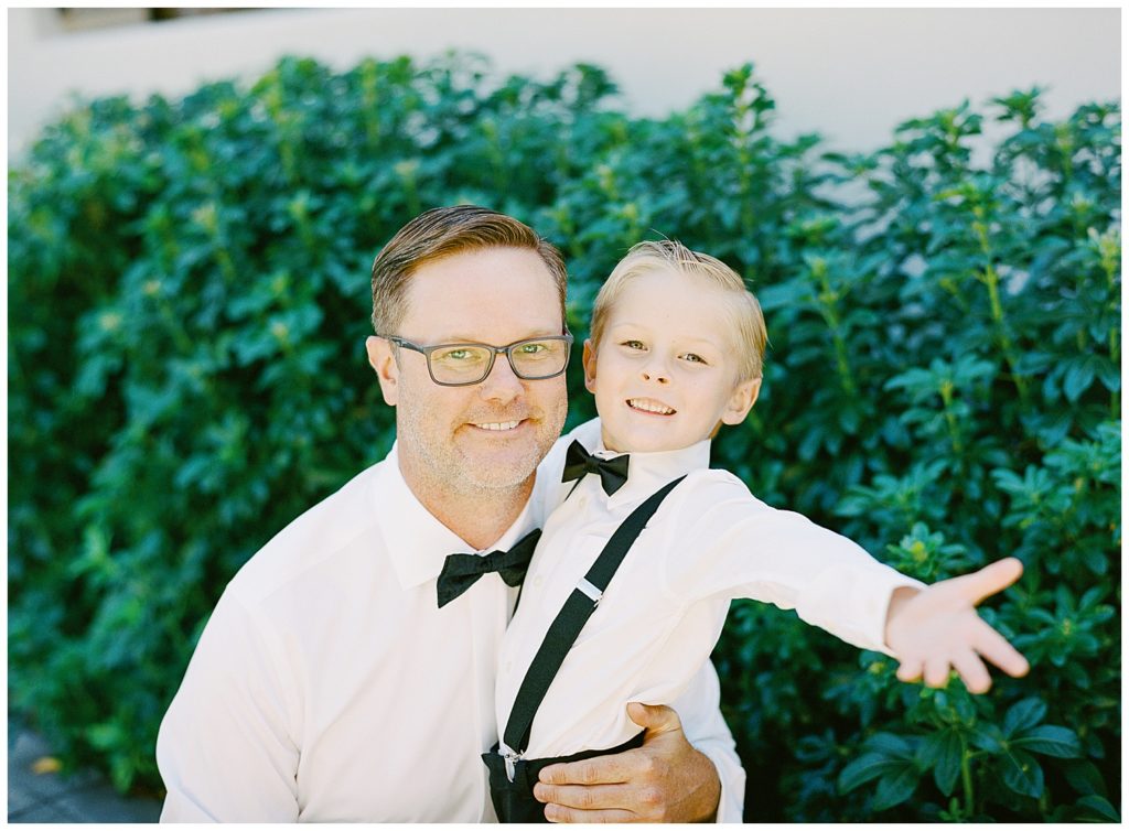 photo of the groom and his son smiling at the camera by film photographer AGS Photo Art