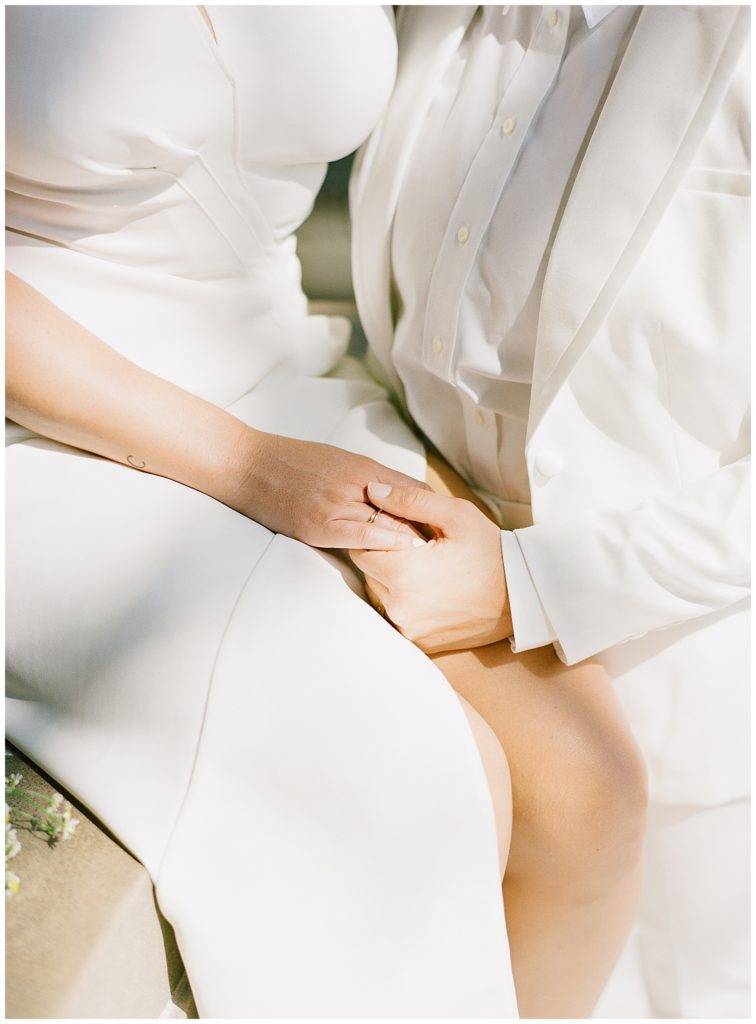 brides' Toni Maticevski white gown and white BHLDN suit