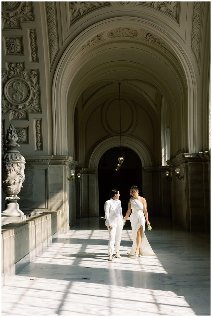 two brides exploring San Francisco City Hall