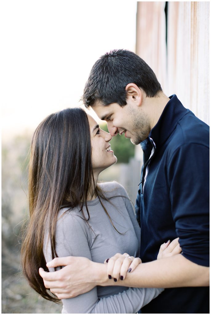couple touching their noses together and smiling