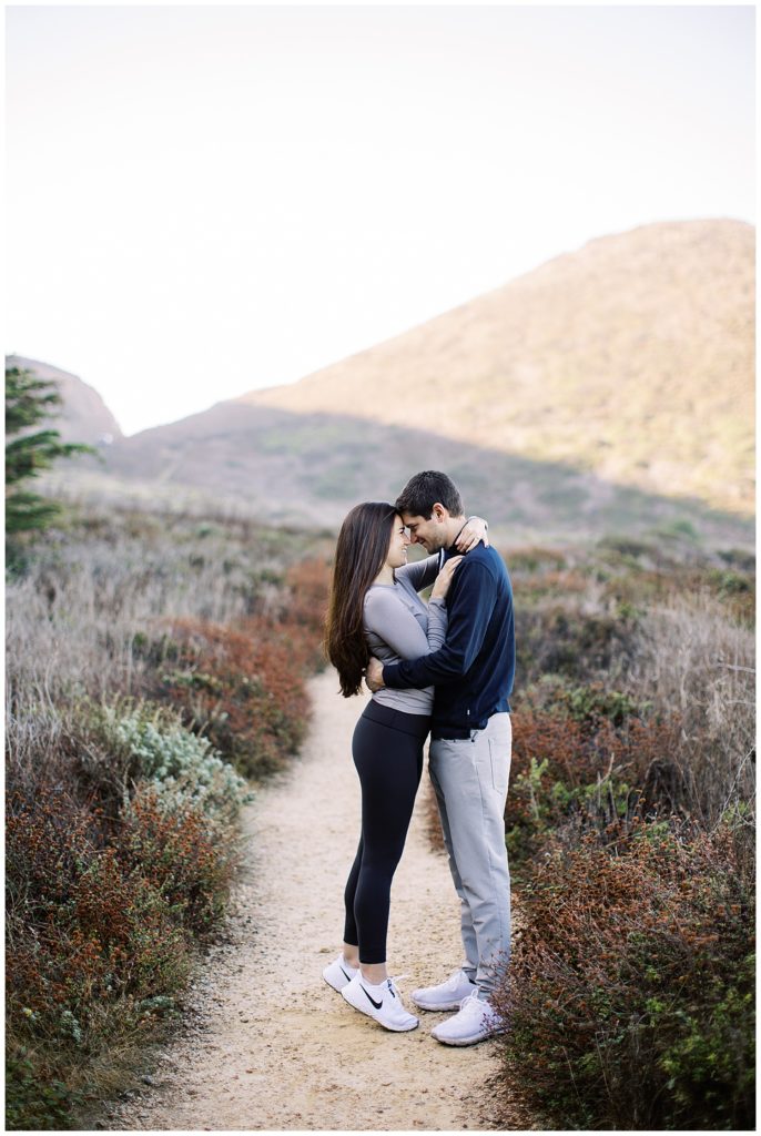 tippy toes height difference Big Sur engagement photoshoot