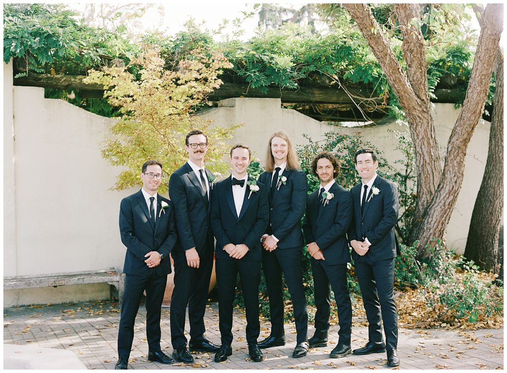 Monterey wedding portrait of the groom and his groomsmen in Memory Garden