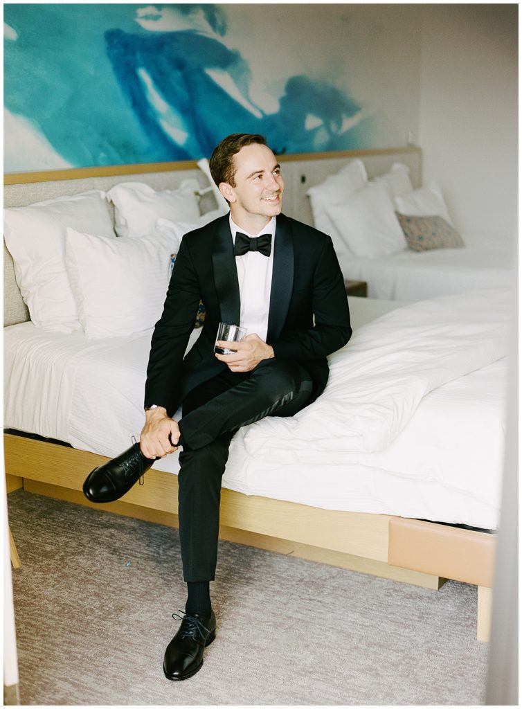 portrait of the groom in his suit after getting ready