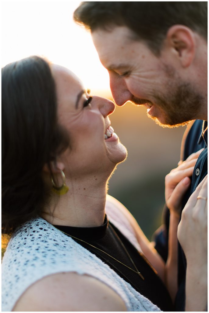 Carmel engagement session portrait of the couple grinning at each other