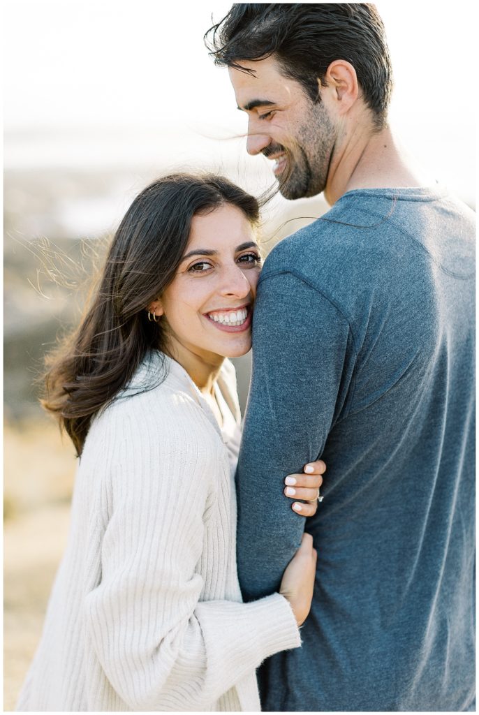 smiling portraits of the couple in each other's arms
