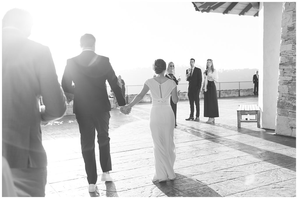 black and white photo of the bride and groom greeting their Carmel Tehama wedding guests