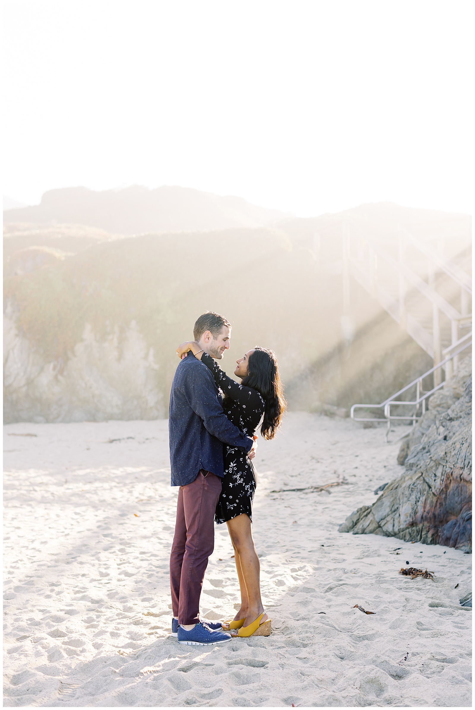 a couple holding each other on the beach for their Big Sur Surprise Proposal