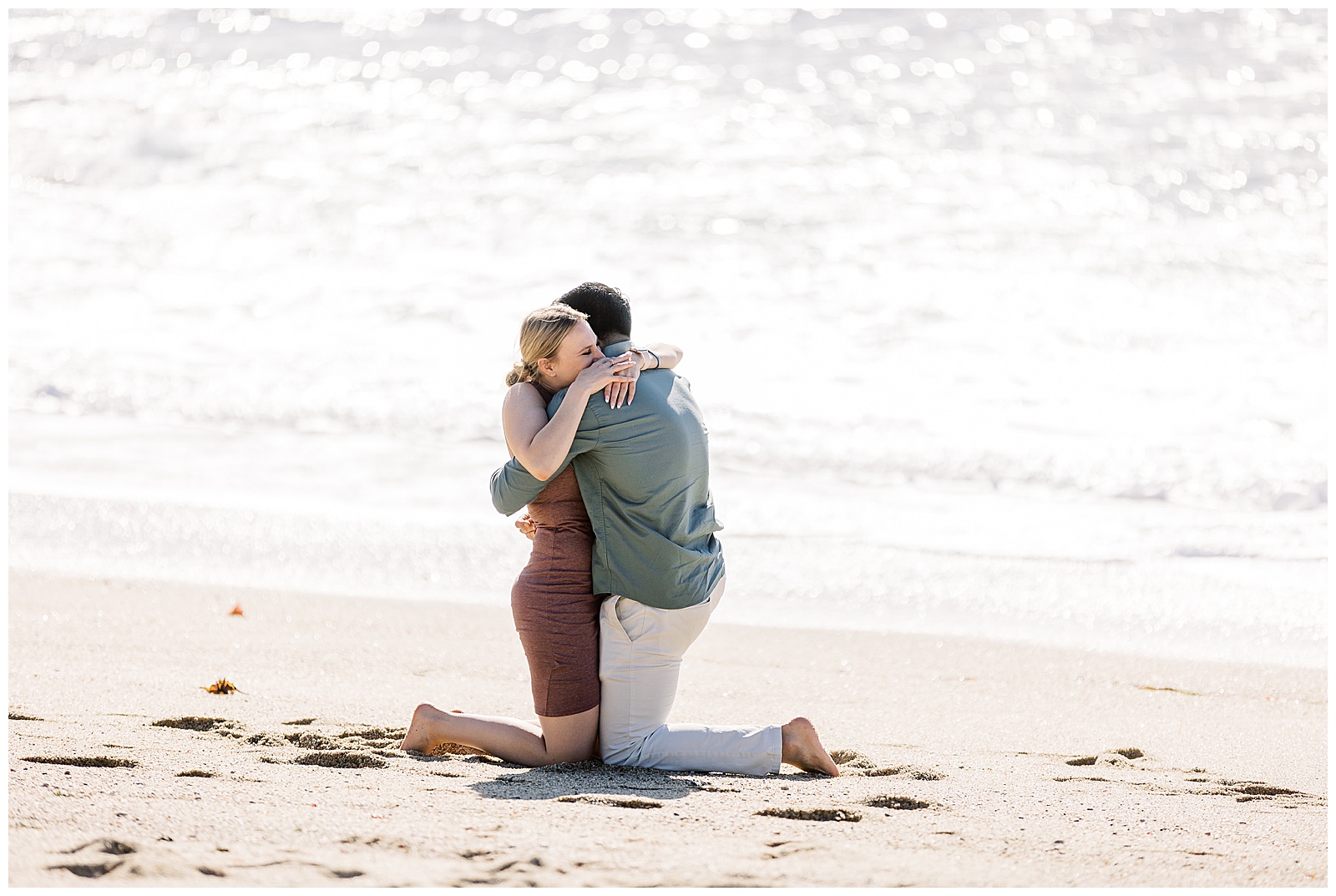 newly engaged couple hugging one another during Carmel surprise proposal