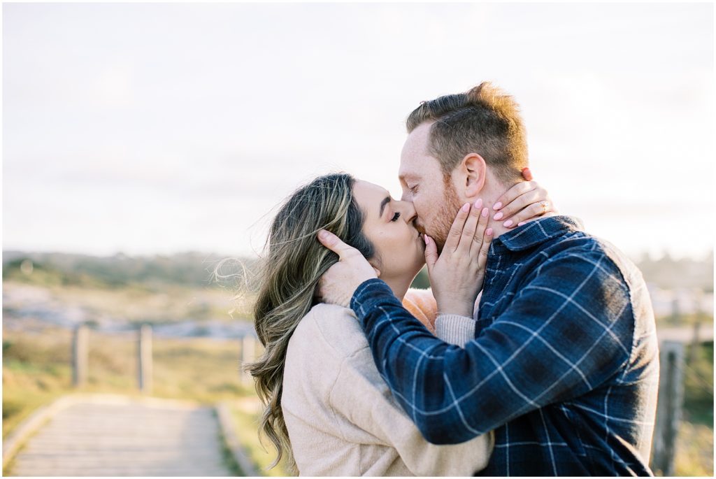 couples kissing one another during Pebble Beach engagement photographer
