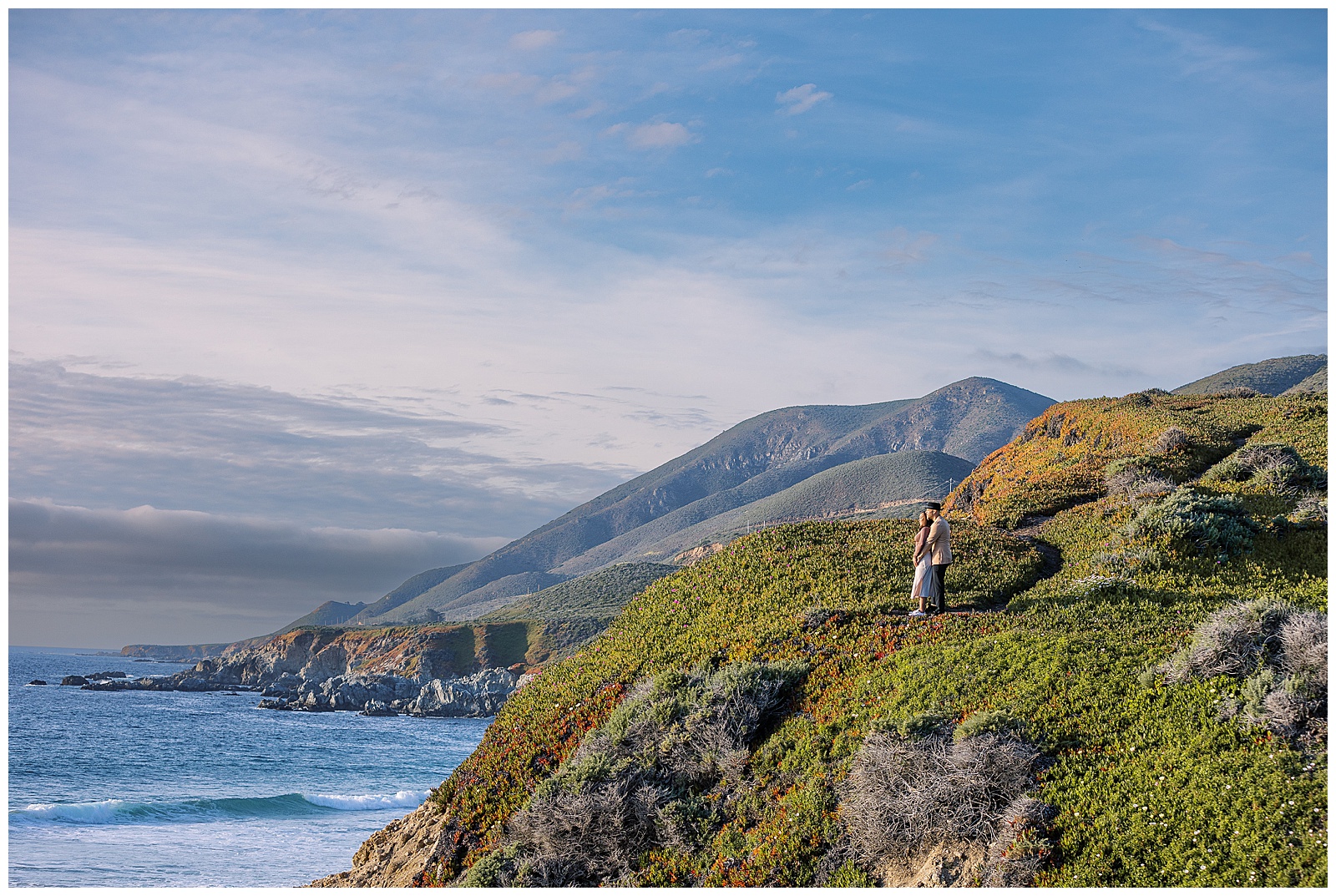 landscape portrait of couple standing together at Big Sur after Calla Lilly Valley Proposal