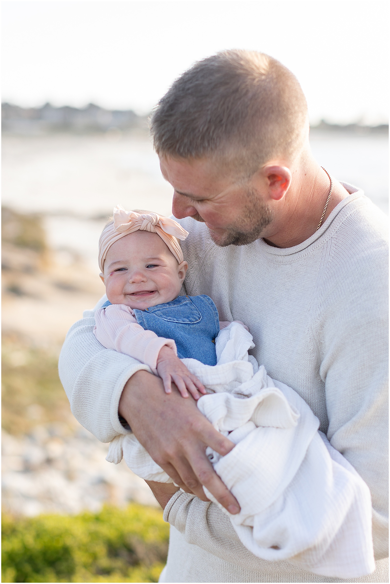 a father holding his baby for Carmel Family Photoshoot