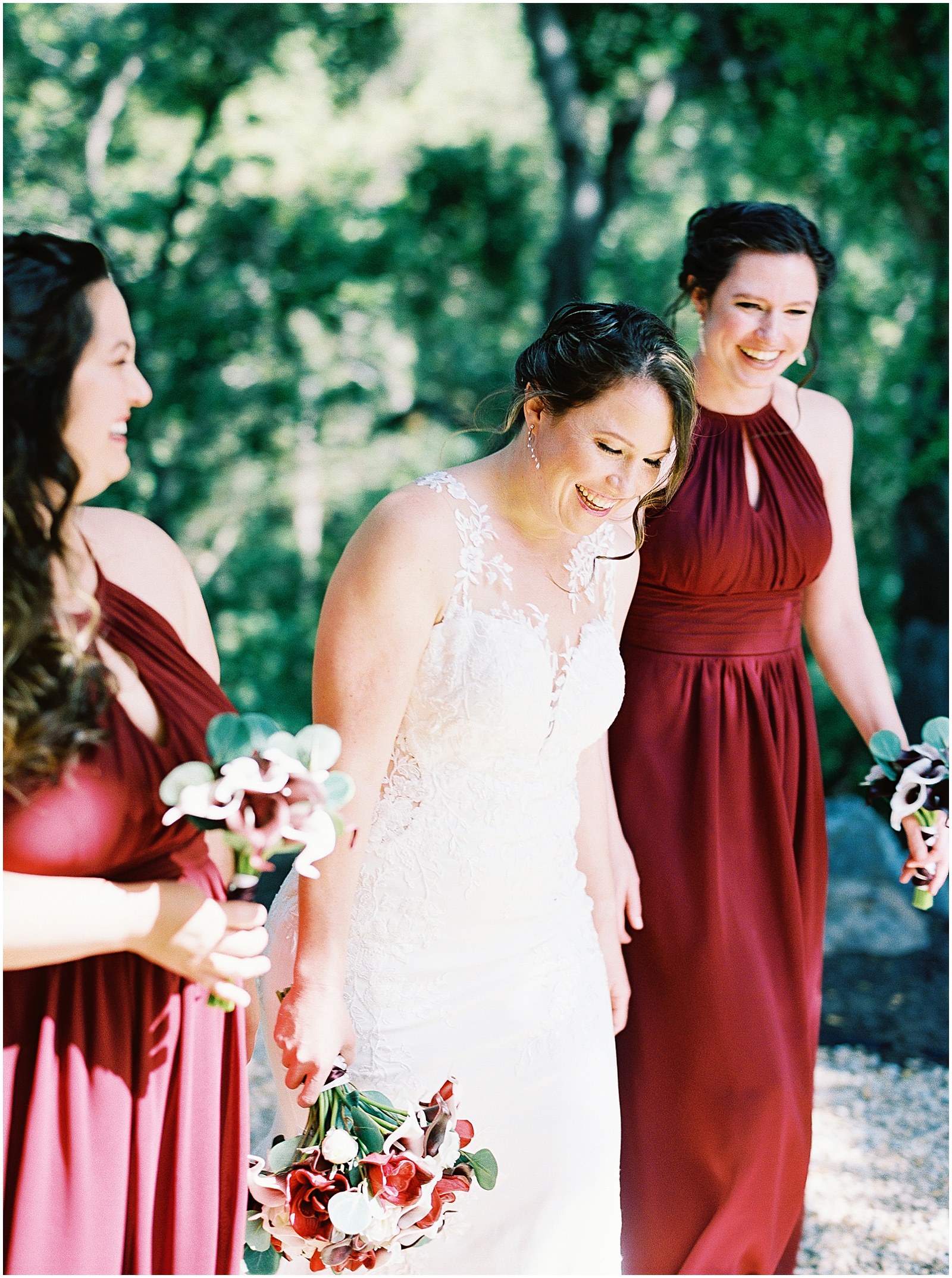 bride laughing with her bridesmaids on her Monterey wedding day