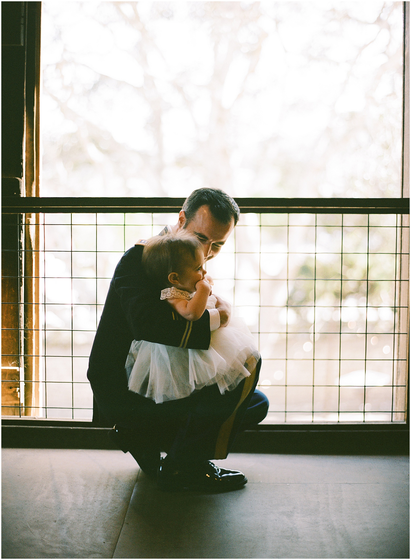 portrait of a groom hugging his daughter before the ceremony with Monterey Wedding Photographer