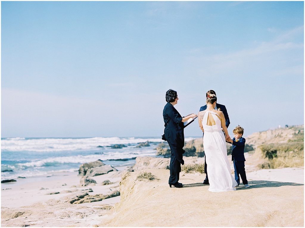 portrait of a bride and groom exchanging vows taken be Pebble Beach Elopement Photographer