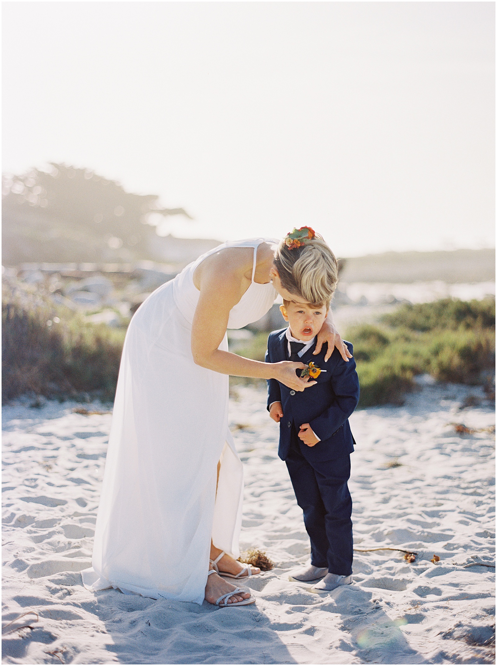 bride helping her son get ready for Pebble Beach Elopement