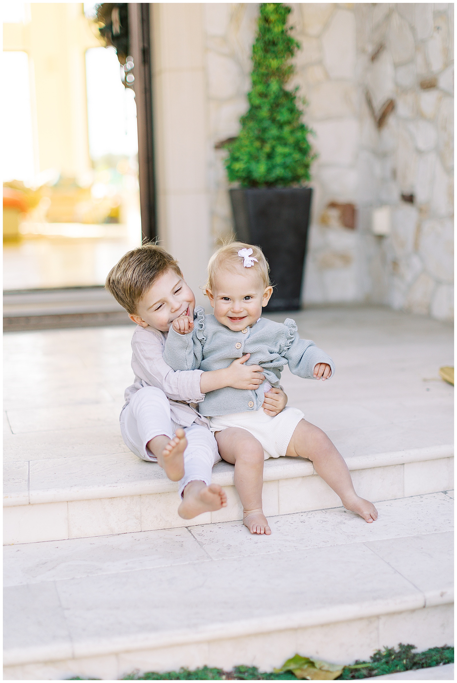 image of two children hugging one another during Pebble Beach family shoot