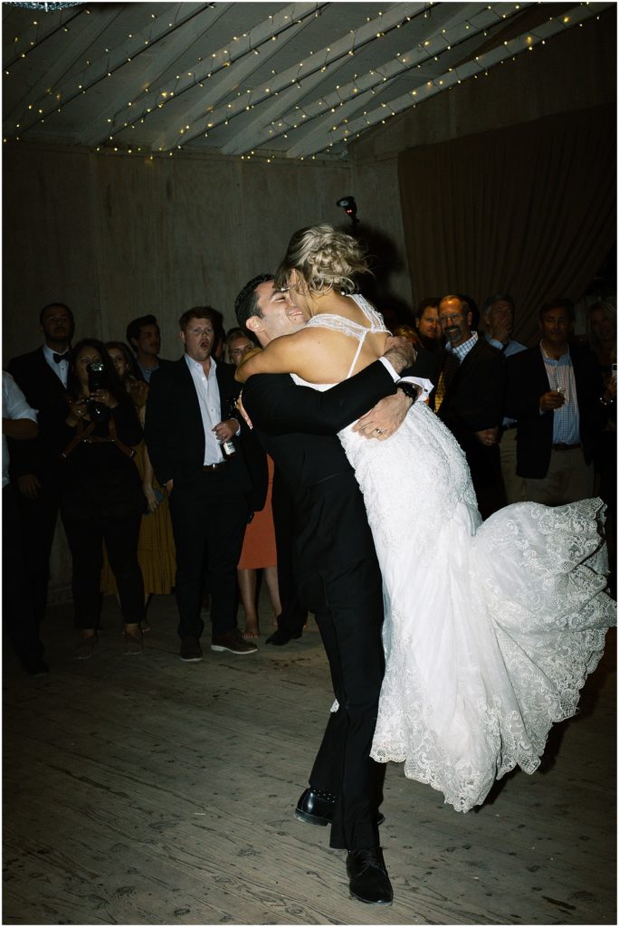 portrait of bride and groom sharing their first dance on dance floor by film photographer AGS Photo Art