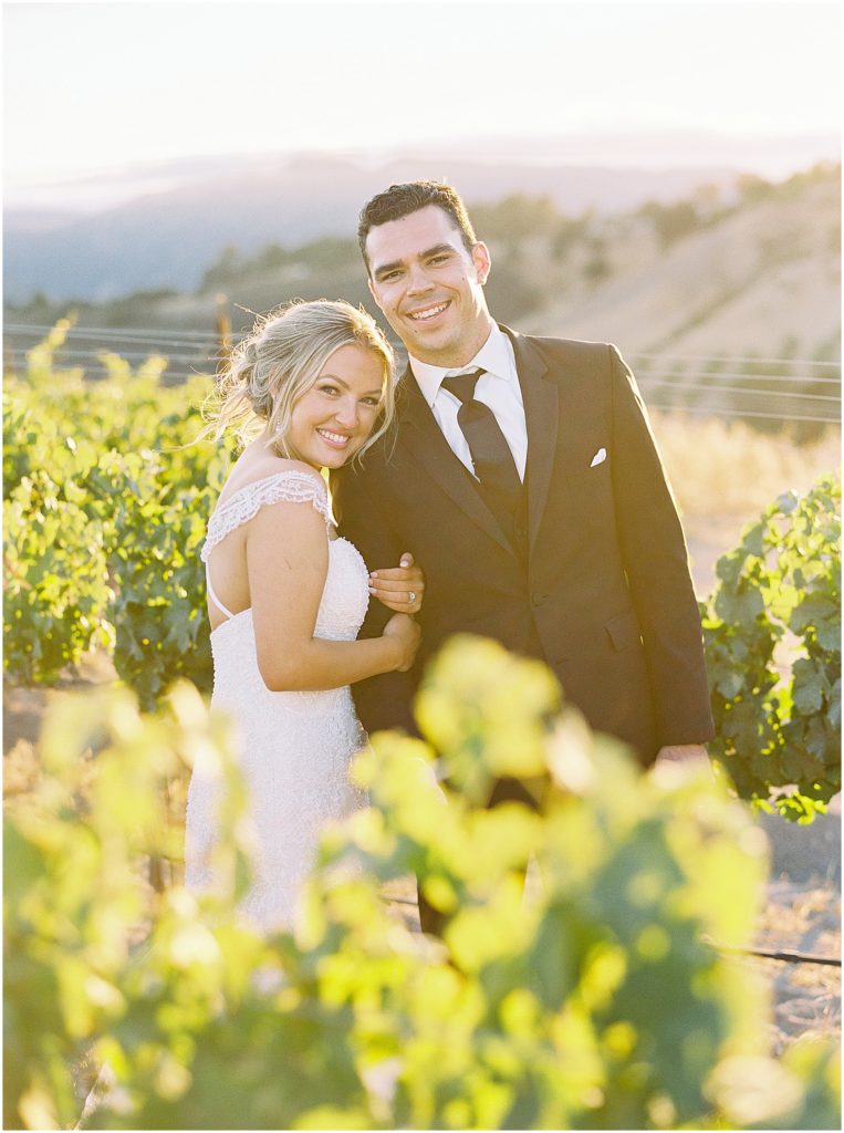 portrait of bride and groom standing in a vineyard by film photographer AGS Photo Art