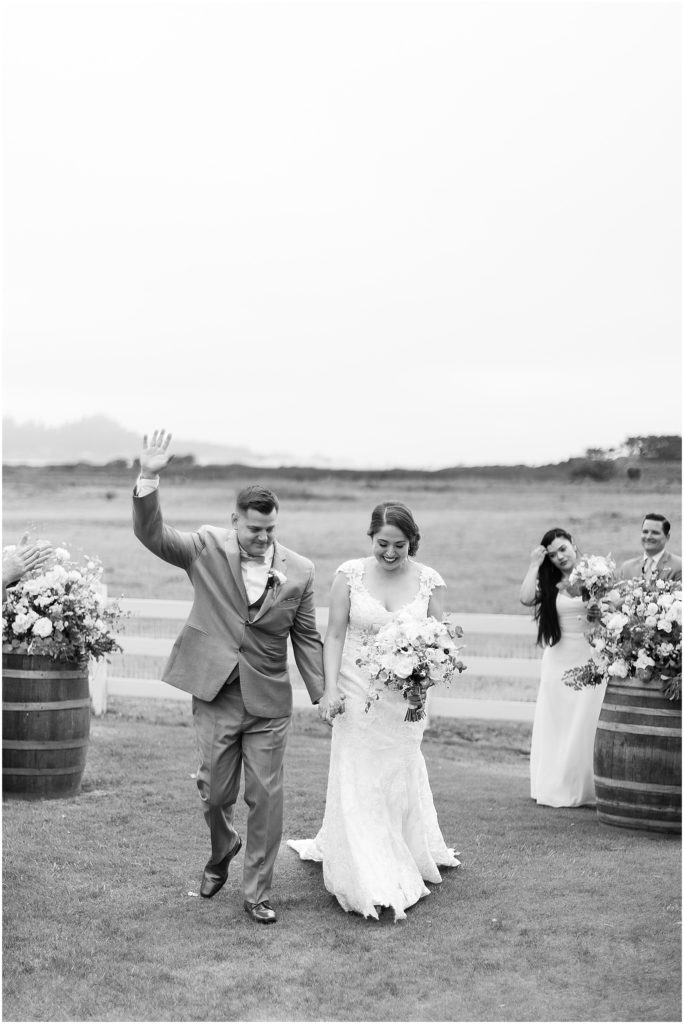 portrait of couple walking off after ceremony by film photographer AGS Photo Art 