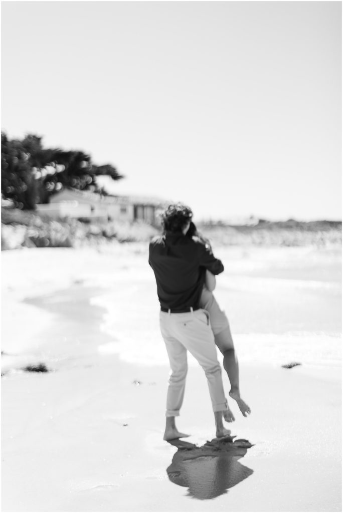 portrait of couple spinning on the beach by film photographer AGS Photo Art