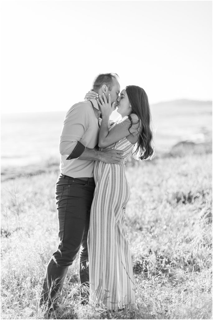 portrait of engaged couple standing in field by film photographer AGS Photo Art