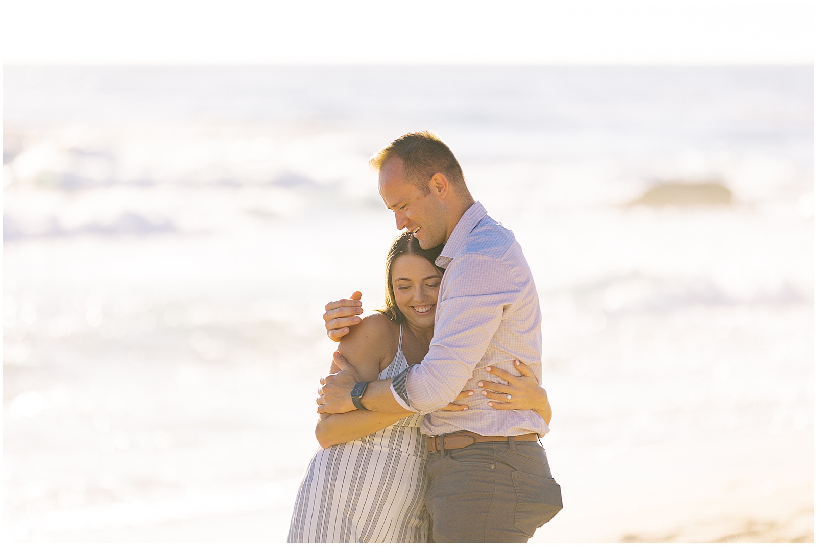 portrait of engaged couple celebrating by the ocean by film photographer AGS Photo Art