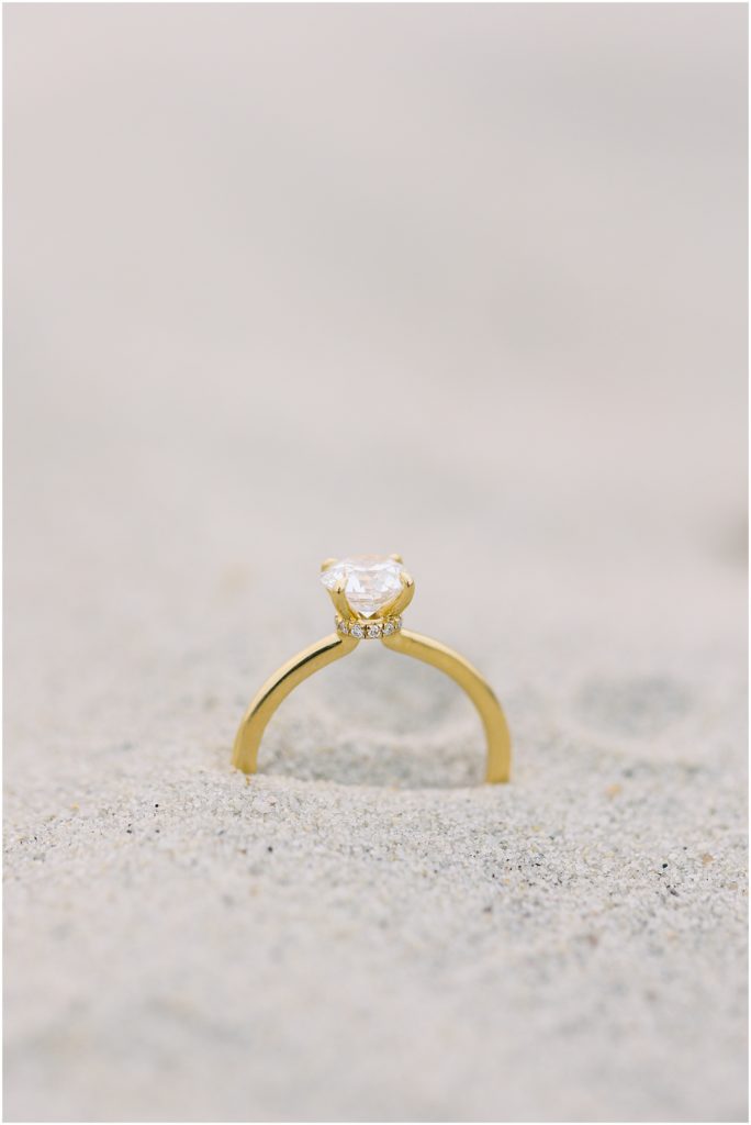 portrait of engagement ring in sand by film photographer AGS Photo Art