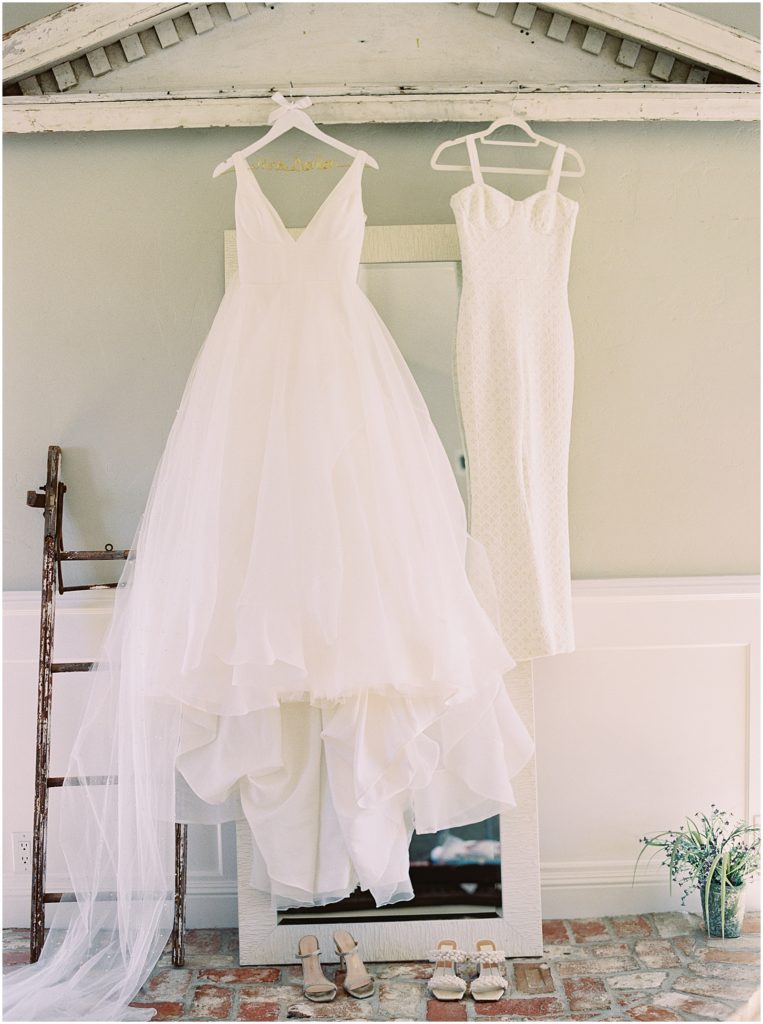 portrait of bridal gown and reception dress on display by film photographer AGS Photo Art 