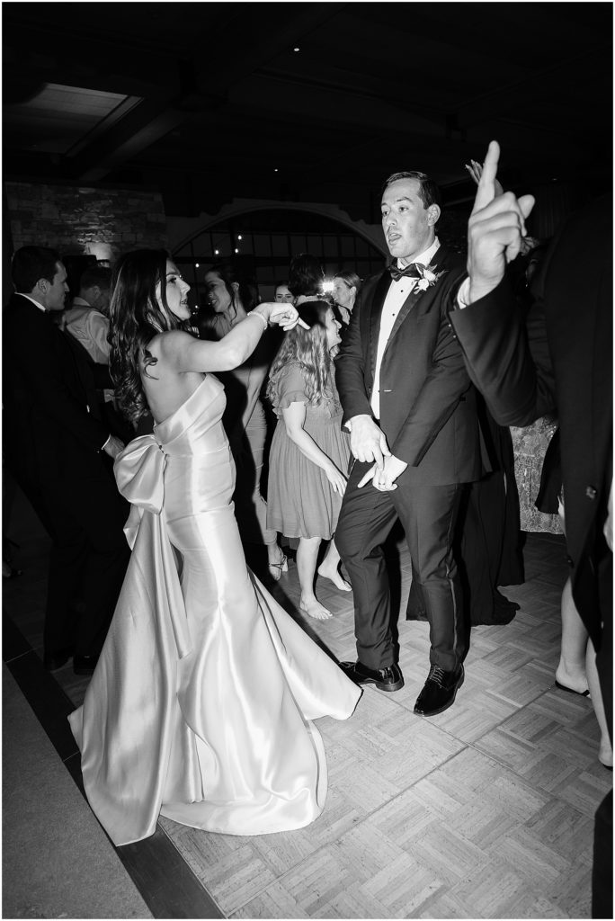 portrait of couple dancing with guests by film photographer AGS Photo Art