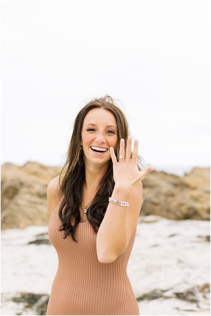 portrait of woman displaying ring on beach by film photographer AGS Photo Art