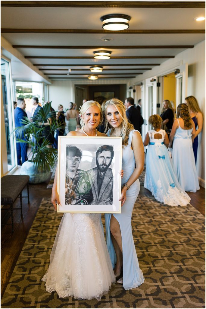 portrait of bride and friend holding a drawing by film photographer AGS Photo Art