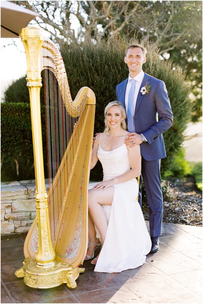 portrait of bride and groom sitting by harp by film photographer AGS Photo Art